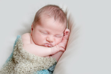 indoor portrait of adorable european newborn baby