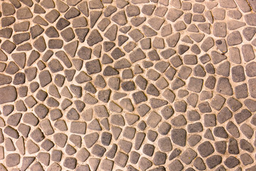 Obraz premium The pebble stone floors and wall, background textures