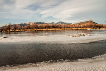 Jefferson River in winter with mountains in the background