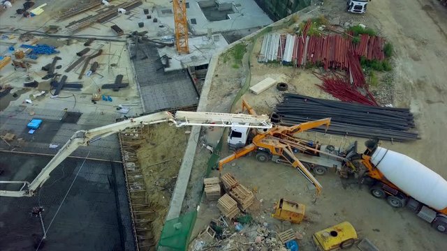 Aerial of team of construction workers are working on concreting at construction site