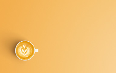 Modern workspace with coffee cup copy space on orange color background. Top view. Flat lay style.