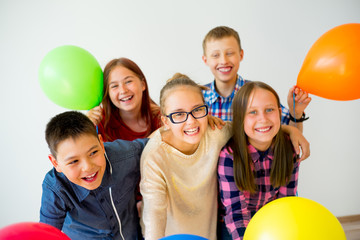 Fototapeta na wymiar Happy children with balloons