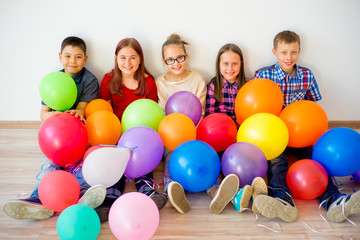 Fototapeta na wymiar Happy children with balloons