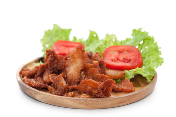 fried pork with garlic on plate isolated on white background