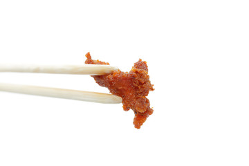 Chopsticks fried pork with garlic isolated on white background