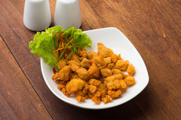 popcorn chicken served on plate