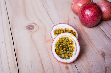Passion fruits on wooden background.  as package design element