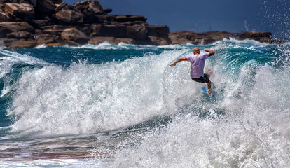 A surfer wipes out on a big wave at Whale Beach. Surfing remains popular in Australia despite an...