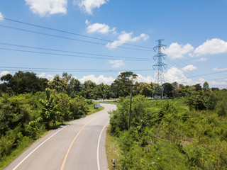 Aerial top view top view of the road through the trees,