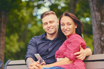 Fototapeta premium A couple using smartphone and instant messaging.