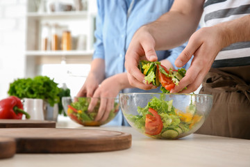 Chef giving cooking classes in kitchen