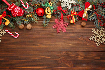Beautiful composition with fir tree branches and decorations on wooden background. Christmas music...