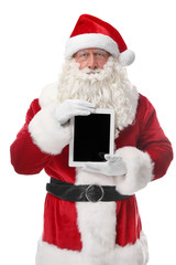Santa Claus holding tablet on white background