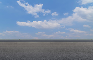 Road pavement and sky clouds