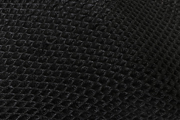 Black nylon protection for motorcycle seat.