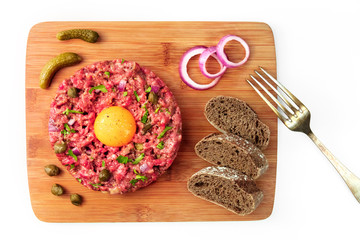Steak tartare with garnish and place for text on white
