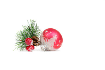 red christmas ball with pine branch isolated on white background, xmas concept