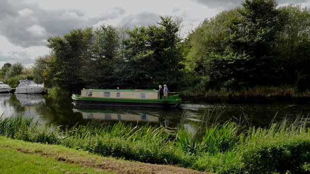 4K video footage of a boat cruising on the river avon stratford upon avon england uk