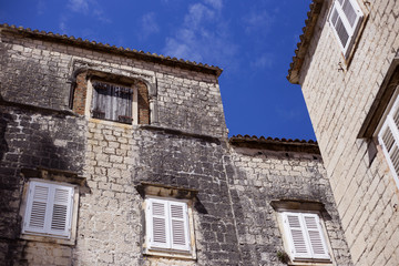 Fototapeta na wymiar Authentic old dalmatian buildings in Trogir, Croatia