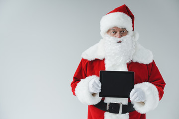 santa claus with digital tablet