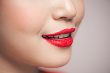 Naklejka premium Close-up of beautiful perfect red lips. Selective focus.