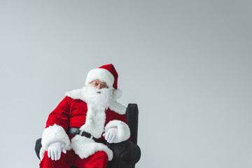 santa claus sitting in armchair
