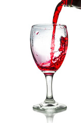 Red wine pouring on a glass isolated on white background. Clipping path