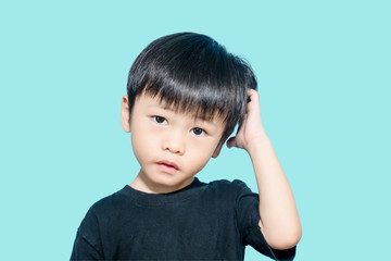 Young asian boy get confused and scratching his head, confusing concept © Jirus