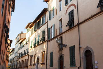 Fototapeta na wymiar Exterior of typical Italian buildings in Lucca, Tuscany, Italy.
