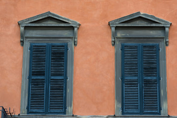 Fototapeta na wymiar Details of the exterior of typical Italian buildings in Lucca, Tuscany, Italy.