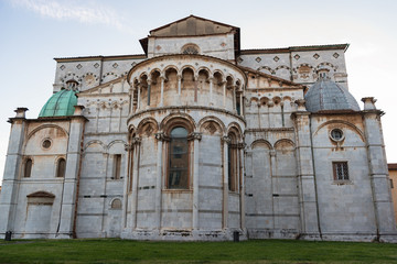 Romanesque Facade and bell tower of St. Martin Cathedral in Lucca, Tuscany. It contains most precious relic in Lucca, Holy Face of Lucca (Italian: Volto Santo di Lucca)