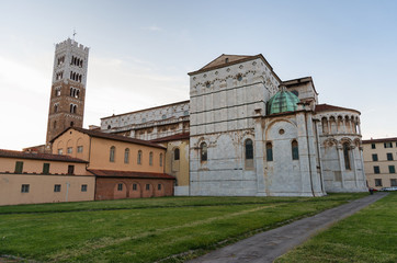 Fototapeta premium Romanesque Facade and bell tower of St. Martin Cathedral in Lucca, Tuscany. It contains most precious relic in Lucca, Holy Face of Lucca (Italian: Volto Santo di Lucca)