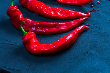 Red hot chilli pepper on a background of bright hot hot