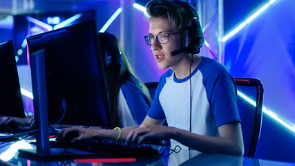 Shot of a Teenage Gamer Team Captain Giving Commands into Microphone. He Plays in Multiplayer Video Game on a eSport Tournament.