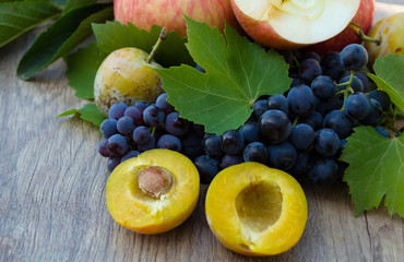 plums with apples and grapes