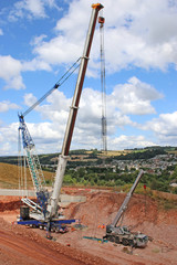 Crane laying concrete bridge beams