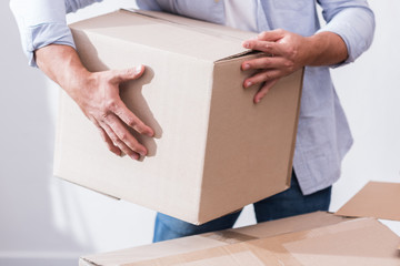 man holding cardboard box