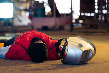 First aid training in the factory industrial. Welder accident in works and fainting in a factory...