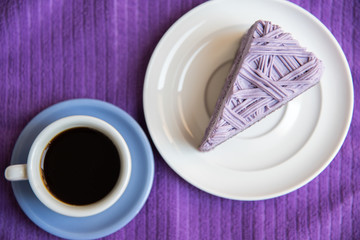 Purple taro cake with coffee at coffee cafe take a break time