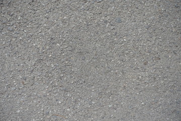 Close up of grainy surface of dusty asphalt