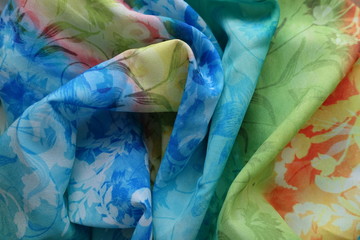 Draped rayon fabric in blue, green, yellow and orangle