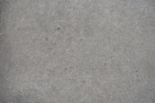 Simple flat grey concrete slab from above