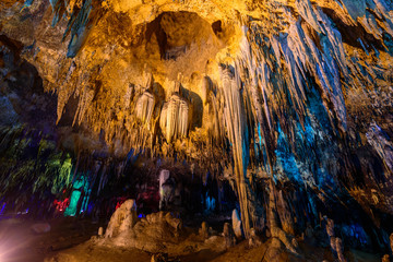 Stalactite stalactites with color lighting in cave