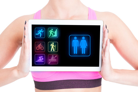 Sporty woman with fitness application on tablet pc