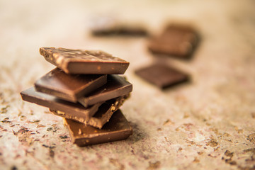 Dark chocolate stack with hazelnuts. Sweet dessert