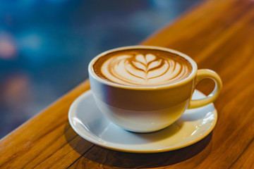 a cup of hot coffee (selective focus for mood and tone)