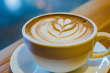 a cup of hot coffee (selective focus for mood and tone)