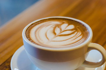 a cup of hot coffee (selective focus for mood and tone)