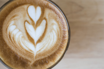 coffee latte art espresso in coffee shop vintage color tone.Cappuccino with beautiful foam coffee cup. Latte art heart shape top view