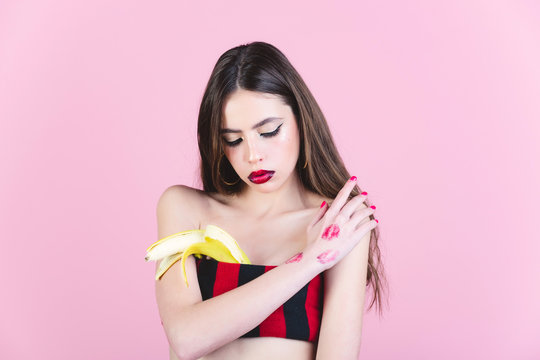 Girl with fashionable makeup with banana.